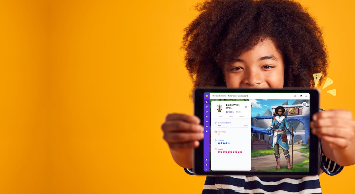 Student holding a tablet showin his classcraft character dashboard